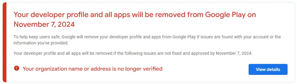 Uma mensagem de aviso exibida no Google Play Console que diz "O nome ou endereço da sua organização não está mais verificado".